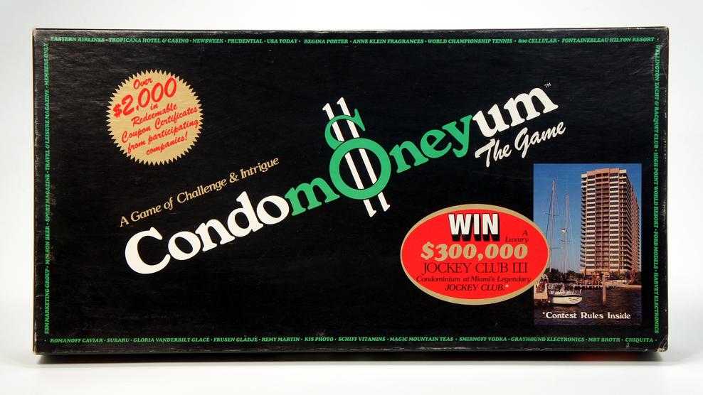 Condomoney board game box featuring a money-themed design and a $300,000 prize announcement.