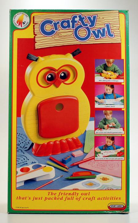 A colorful owl-shaped educational toy with interactive buttons and screens.