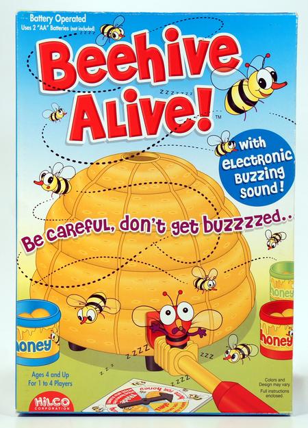 Colorful Beehive Alive toy with buzzing sound and honey jars.
