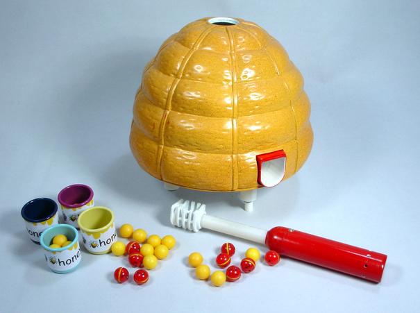 Vintage Candy Land game with a beehive and colorful candies.