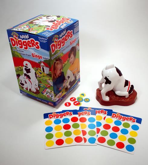 A children's game with a dog figure and colorful game cards.