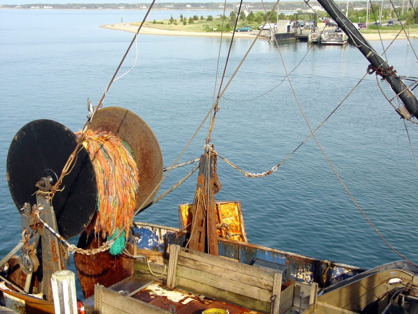 Fishing boat equipment with nets and ropes by the sea.