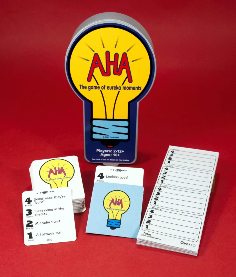 AHA Brainstorming card game with lightbulb-shaped box and various cards.