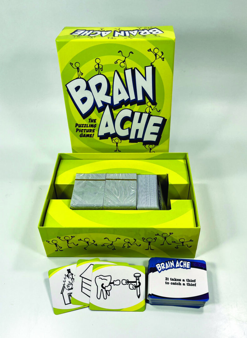 A handheld electronic game called Brain Ache with a bright green box.