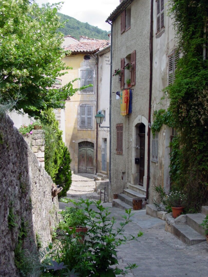 A narrow, charming street in a quaint European village.