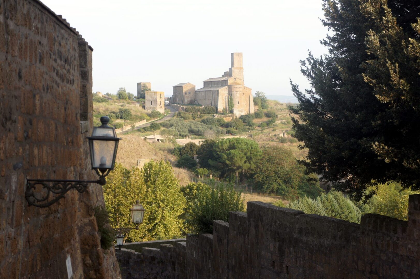 Scenic view of an old castle on a hill with greenery.