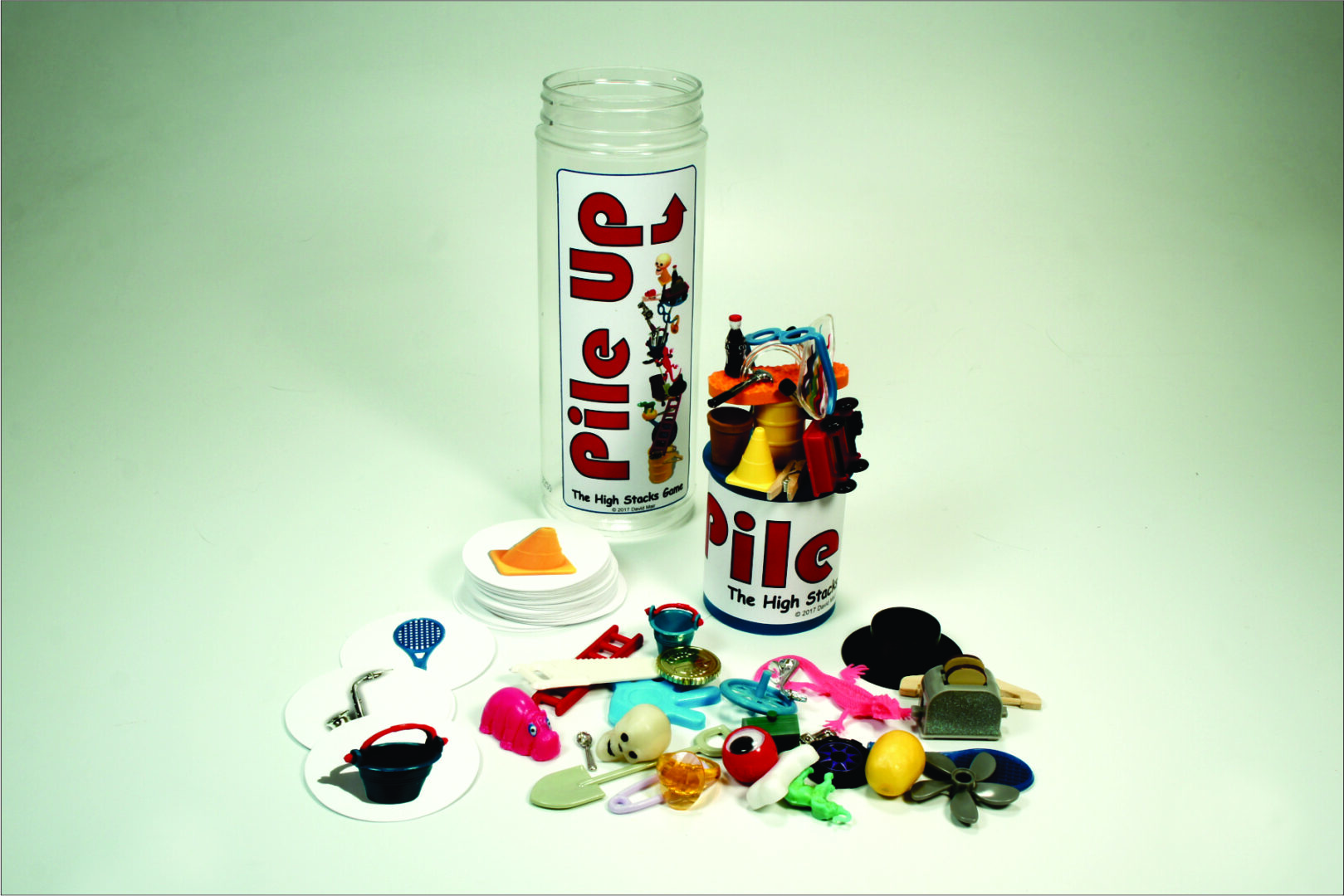 A spilled jar of colorful miniature figures and accessories from Pilots.