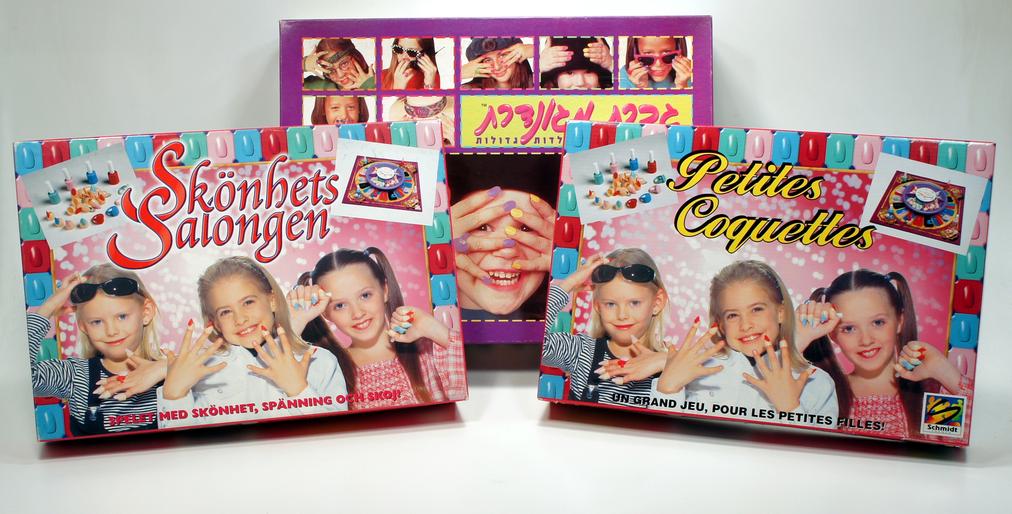 Three colorful packaging boxes featuring smiling children and playful designs.