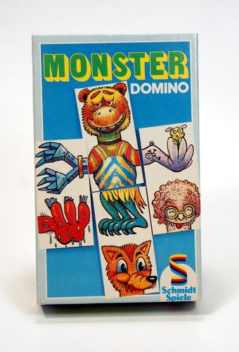 Vintage Monster Domino game box with colorful monster illustrations.