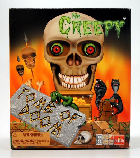 A spooky board game titled 'The Creepy' featuring a skull and eerie figures.