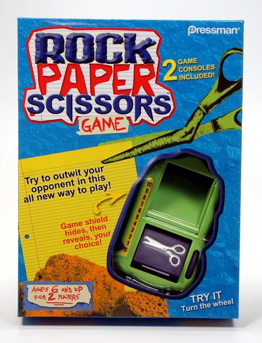 A green handheld Rock Paper Scissors electronic game from Tiger Electronics.