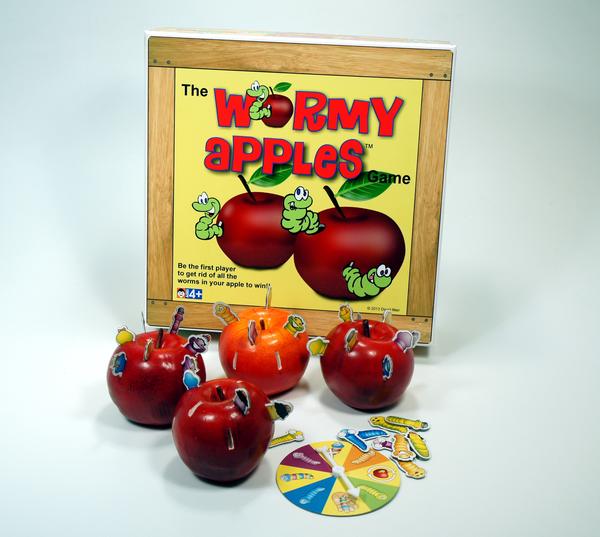The Wormy Apples board game with colorful apples and a spinner.