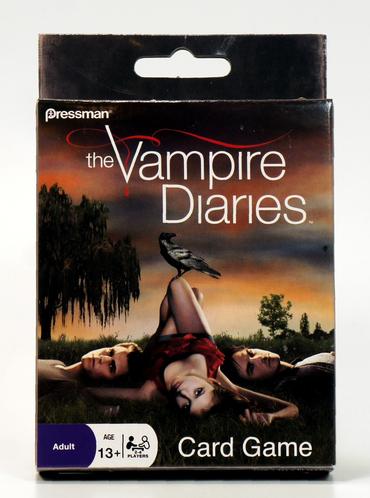 Cover of The Vampire Diaries book with a woman lying on the ground at sunset.
