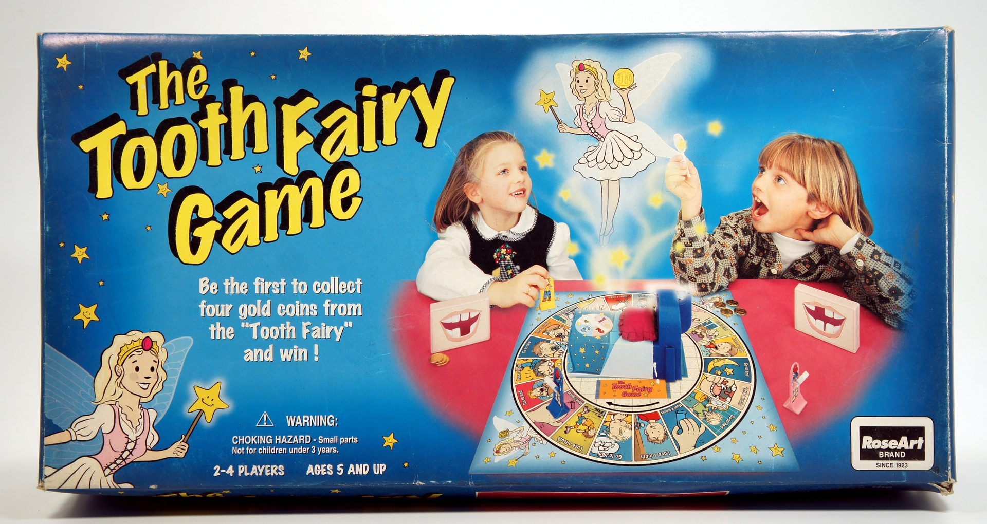 Children playing the colorful board game 'Fairy Game' with fairy illustrations.