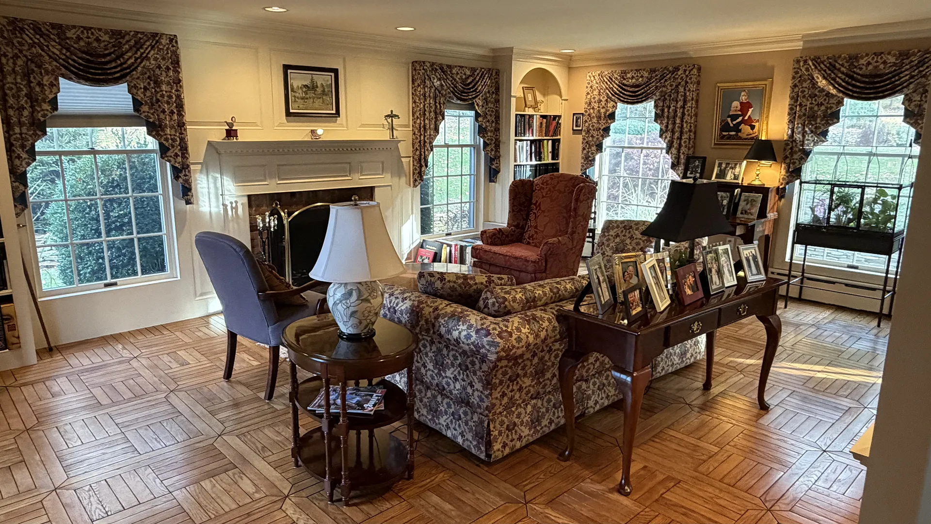 Cozy living room with classic furniture and warm lighting.