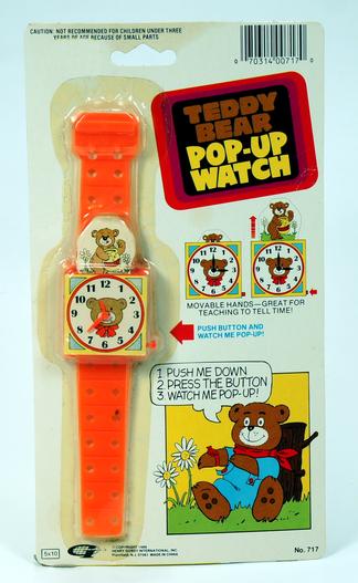 Vintage Garfield pop-up watch with orange strap in original packaging.