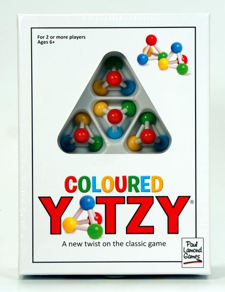 Box of Coloured Yotzy game with colorful dice.