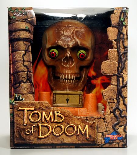 Board game "Tomb of Doom" box featuring a fiery skull.