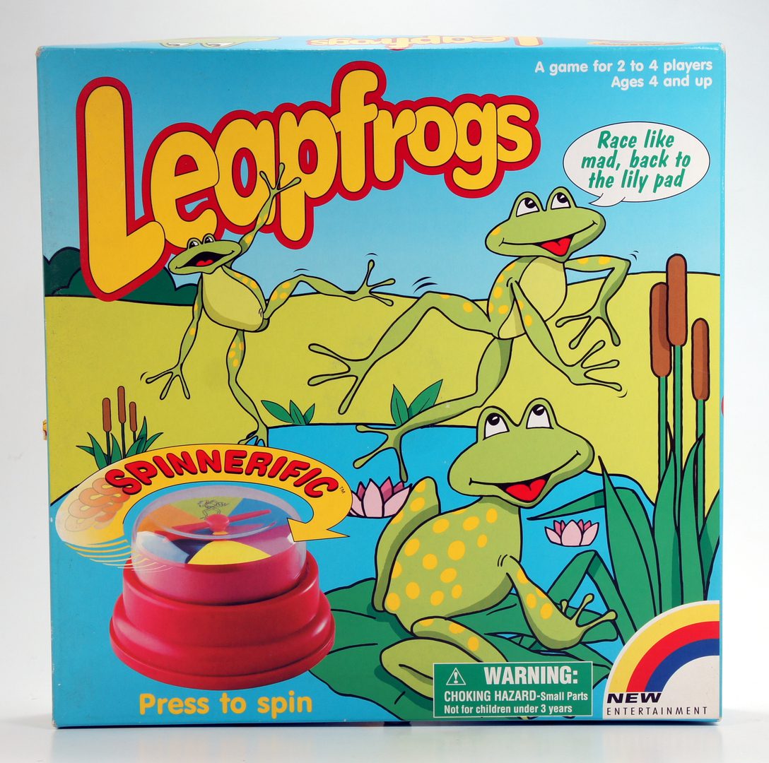 Vintage Leapfrog game with frogs on the cover and colorful game pieces.
