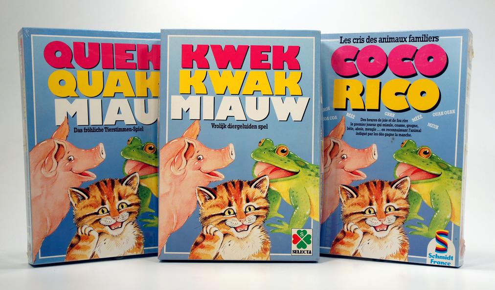Three colorful bags of Kwek Kwak cat food with cat images.