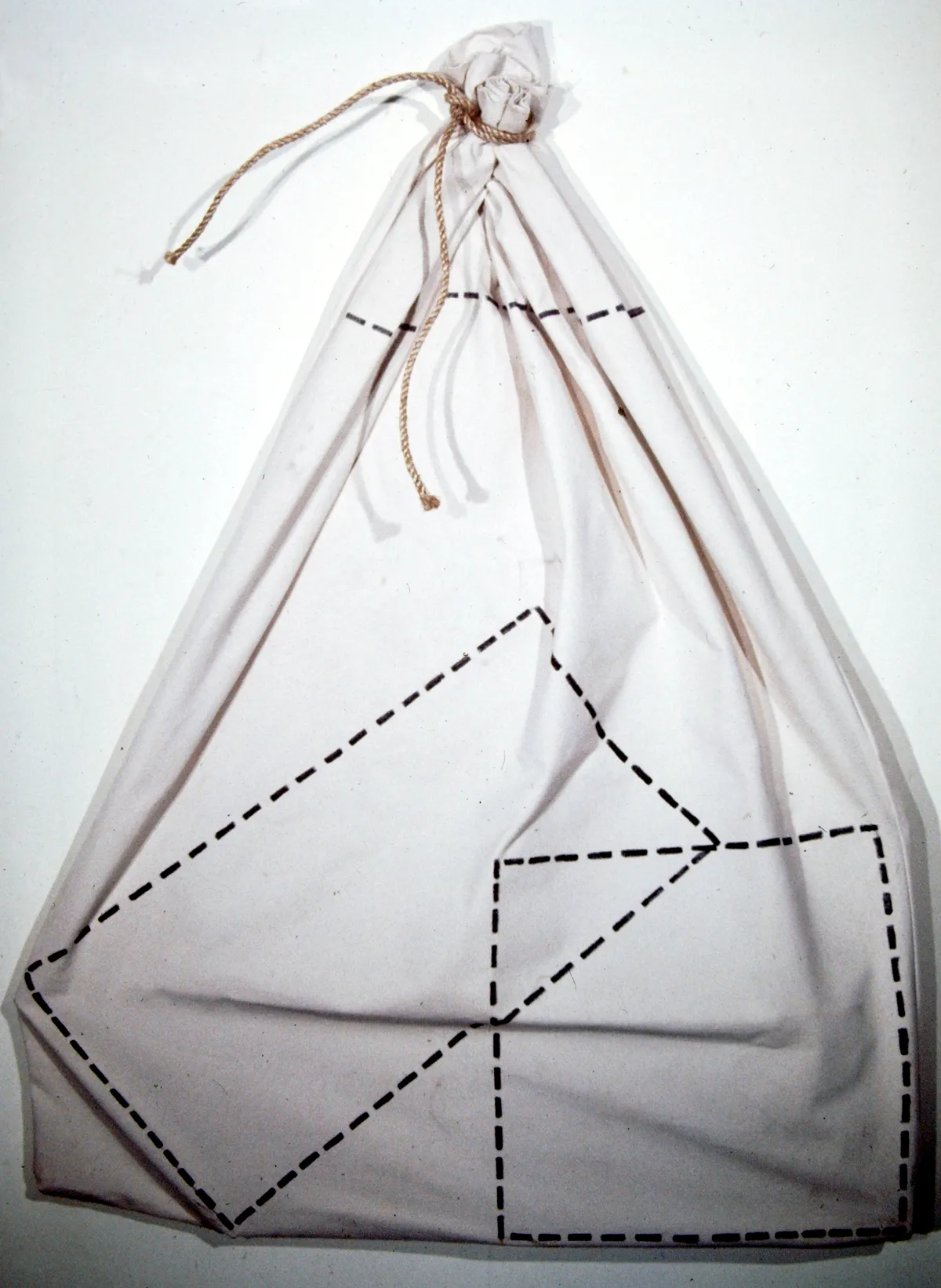 Minimalist white teepee with black geometric patterns.