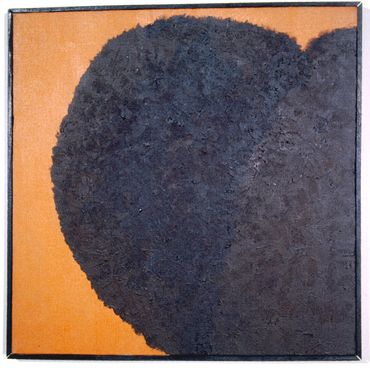 Abstract painting with large dark blue shape on orange background.