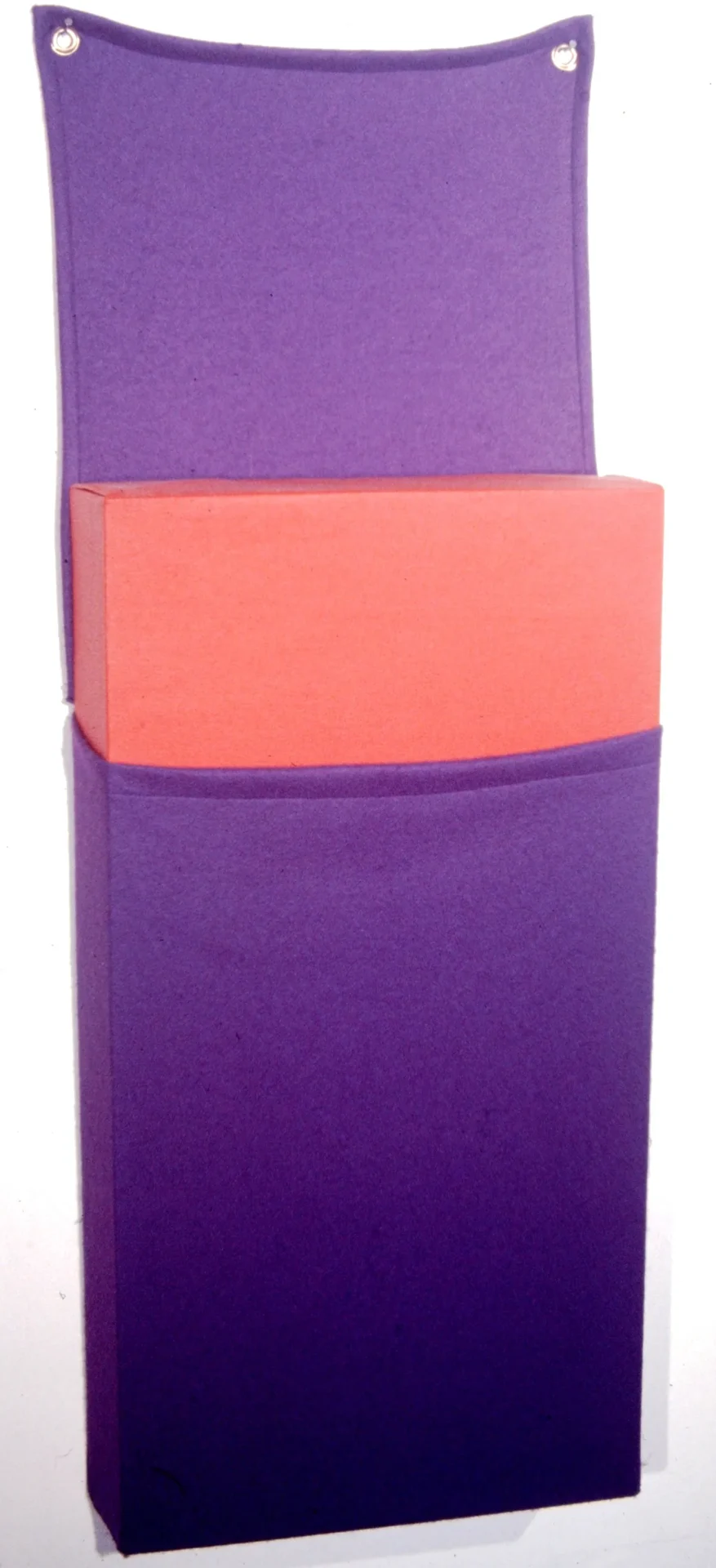 Stacked colorful yoga blocks in purple and orange.