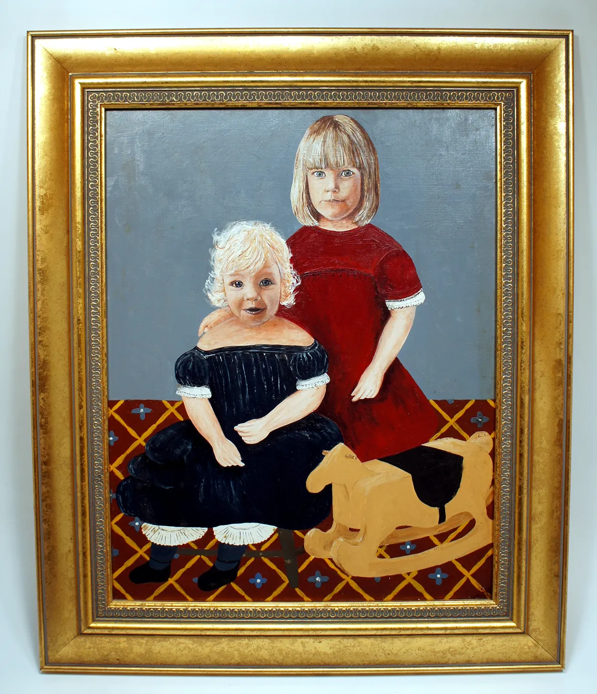 Portrait of two young girls, one with blonde hair standing, the other with white hair sitting beside a dog.