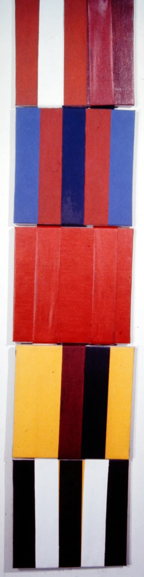Stacked colorful rectangular blocks arranged vertically.