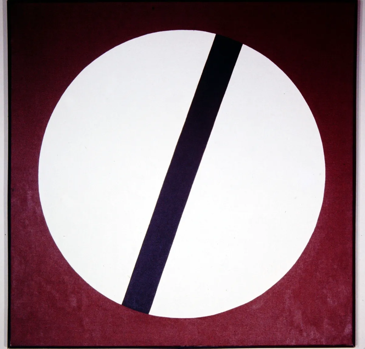 Abstract art with a white circle and a diagonal black line on a red background.