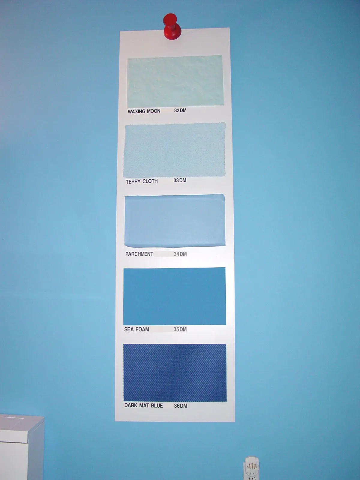 A vertical paint swatch with six blue shades labeled from light to dark.