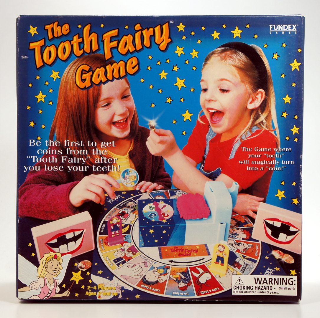 Children playing The Tooth Fairy board game with excitement.