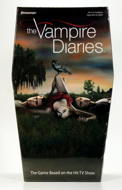 A vampire lies on the grass at dusk with a crow perched on her feet.