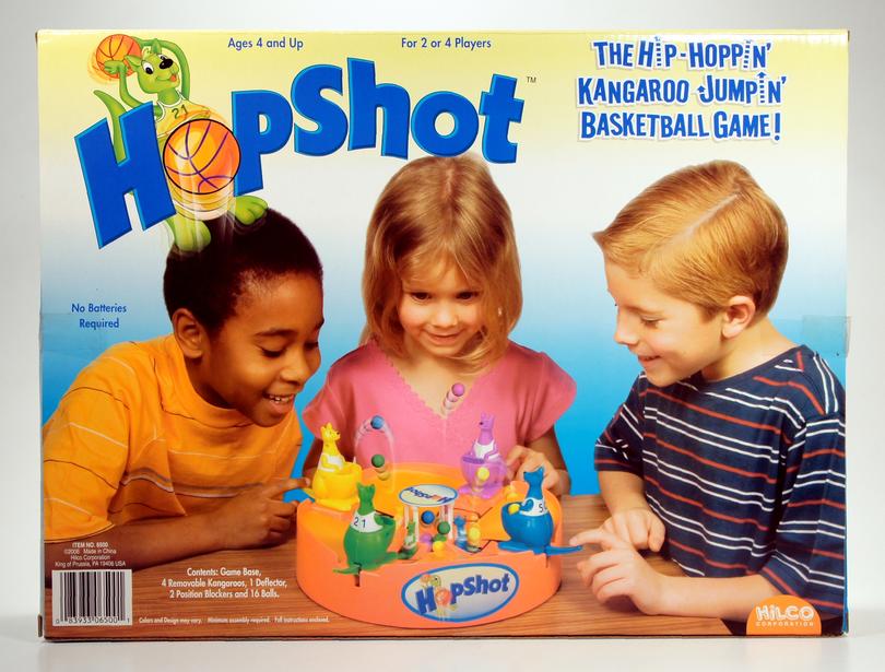 Three children playing the hip-hop themed game Hip Shot together.