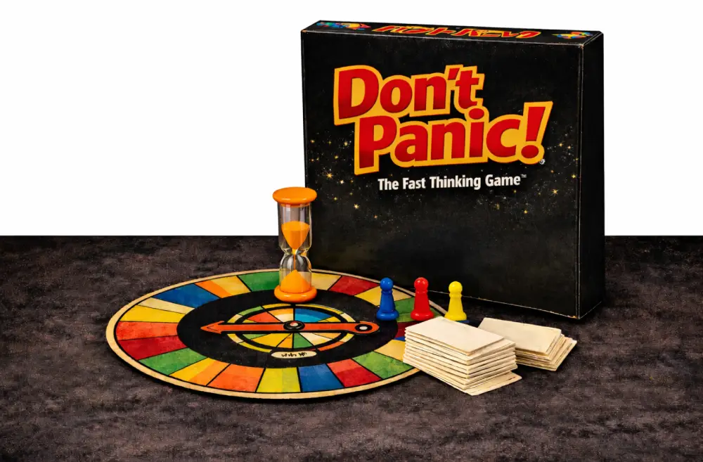 The board game "Don't Panic!" with colorful pieces and cards.