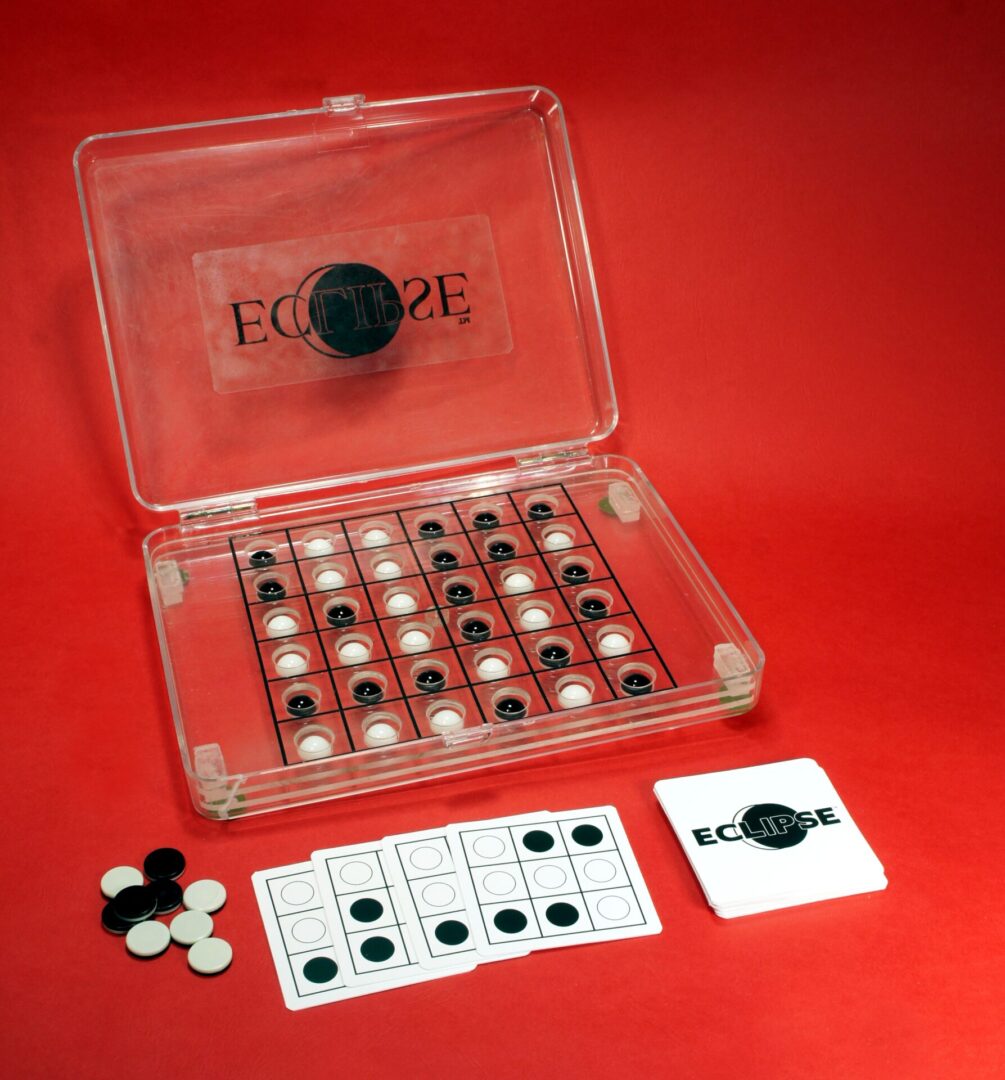 Educational kit with black and white discs for learning or experimentation.