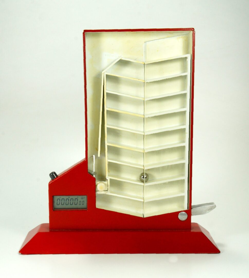 Model of a modern multi-story building with a red base.