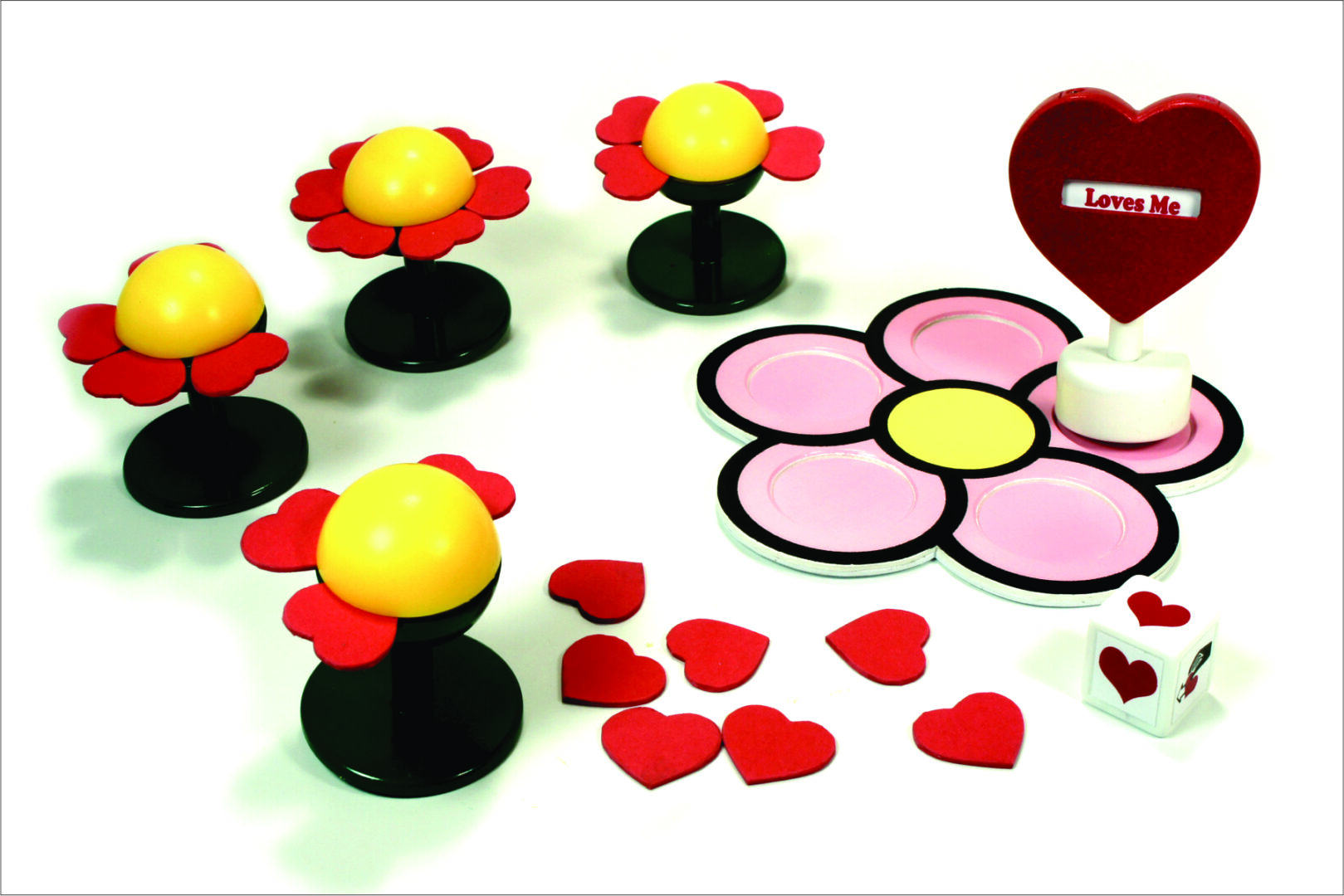 Colorful flower-shaped figurines with scattered red petals on a white surface.