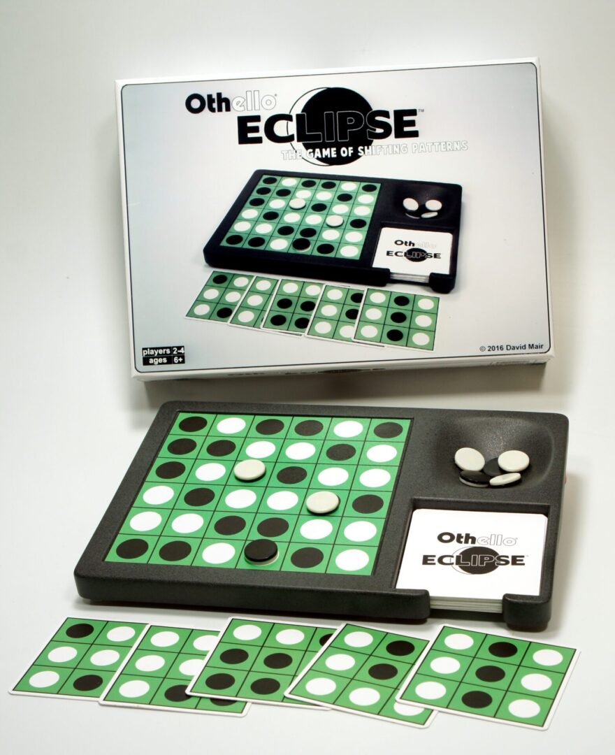 Vintage Othello Eclipse board game with pieces and box.