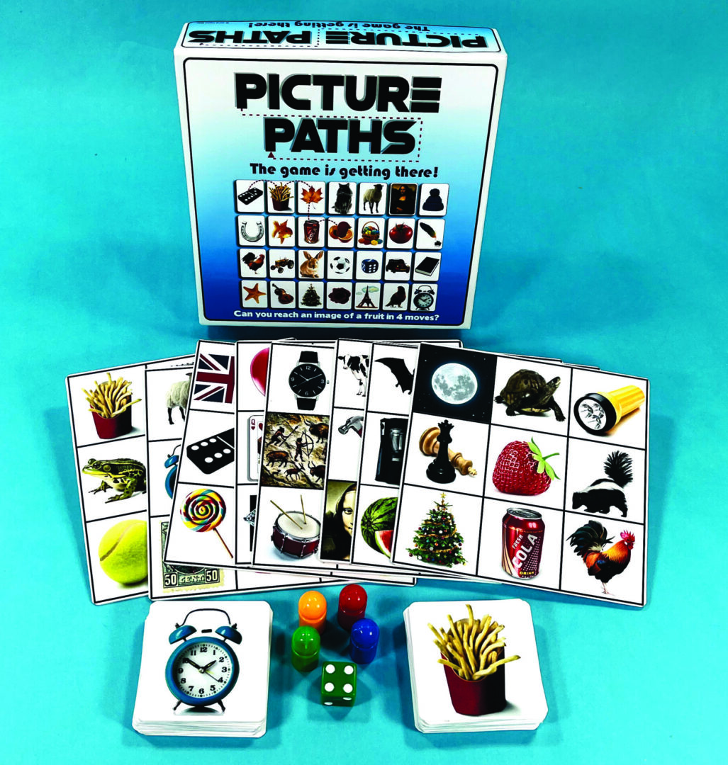 A colorful board game called Picture Paths with cards and dice.