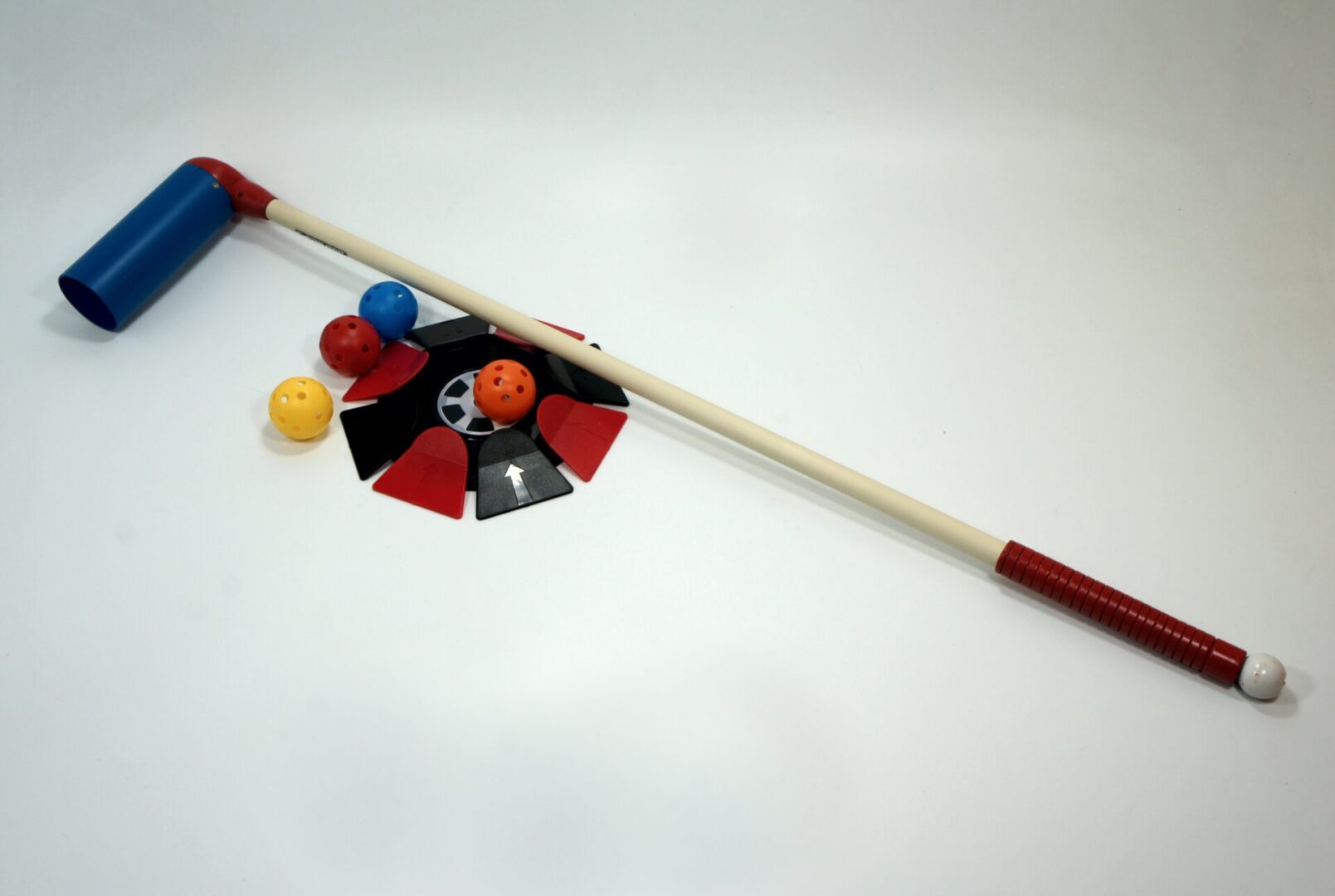 Traditional fishing rod with attached colorful bobbers and lure.