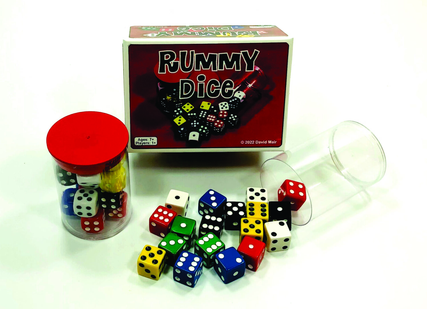 A collection of colorful rummy dice with a red cup and box.