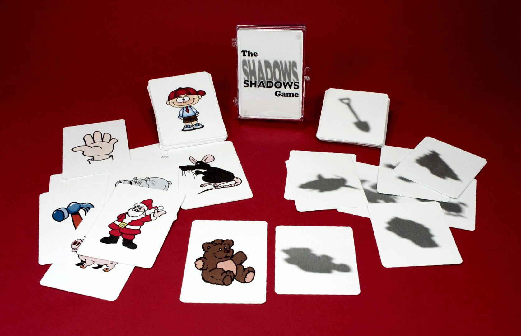 A set of illustrated cards with shadows and objects on a red background.