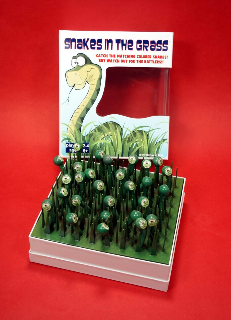 Display of dinosaur-shaped lollipops with a humorous sign.