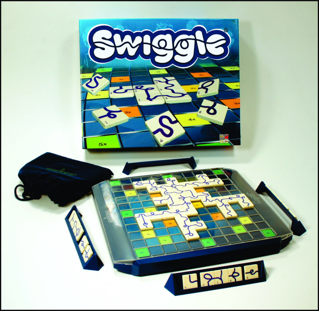 Swiggle board game with tiles and timer on a table.