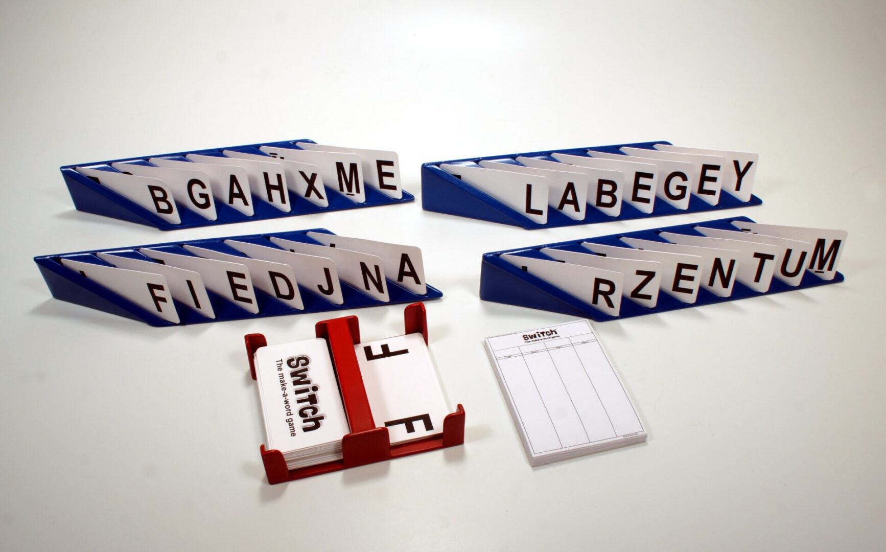 A word-building board game with letter tiles and score sheets.